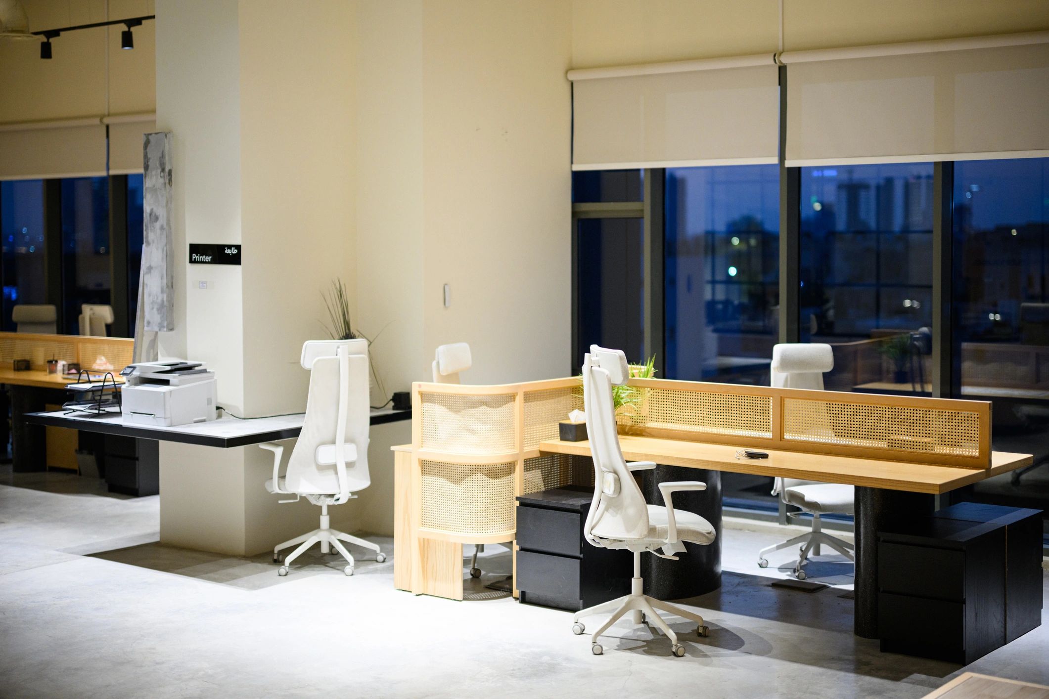 Modern office workspace with printers and support-ready environment